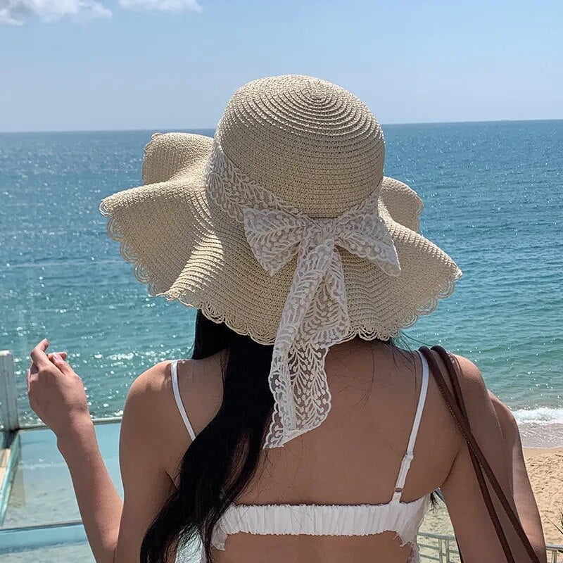 a woman worn a sun hat in summer time